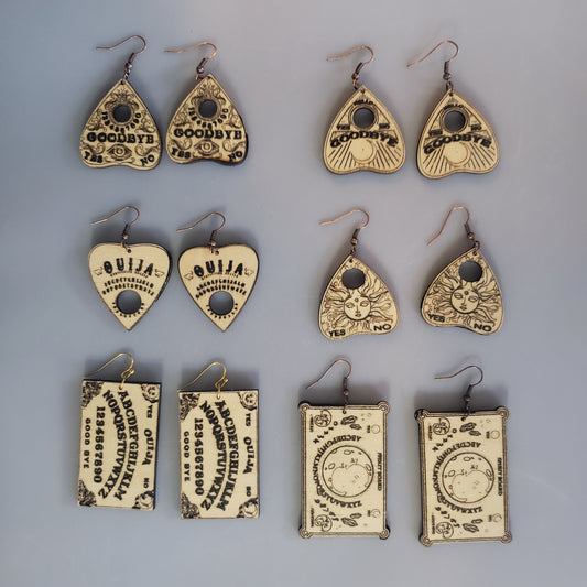 A variety of wood ouija, planchette or spirit board earrings