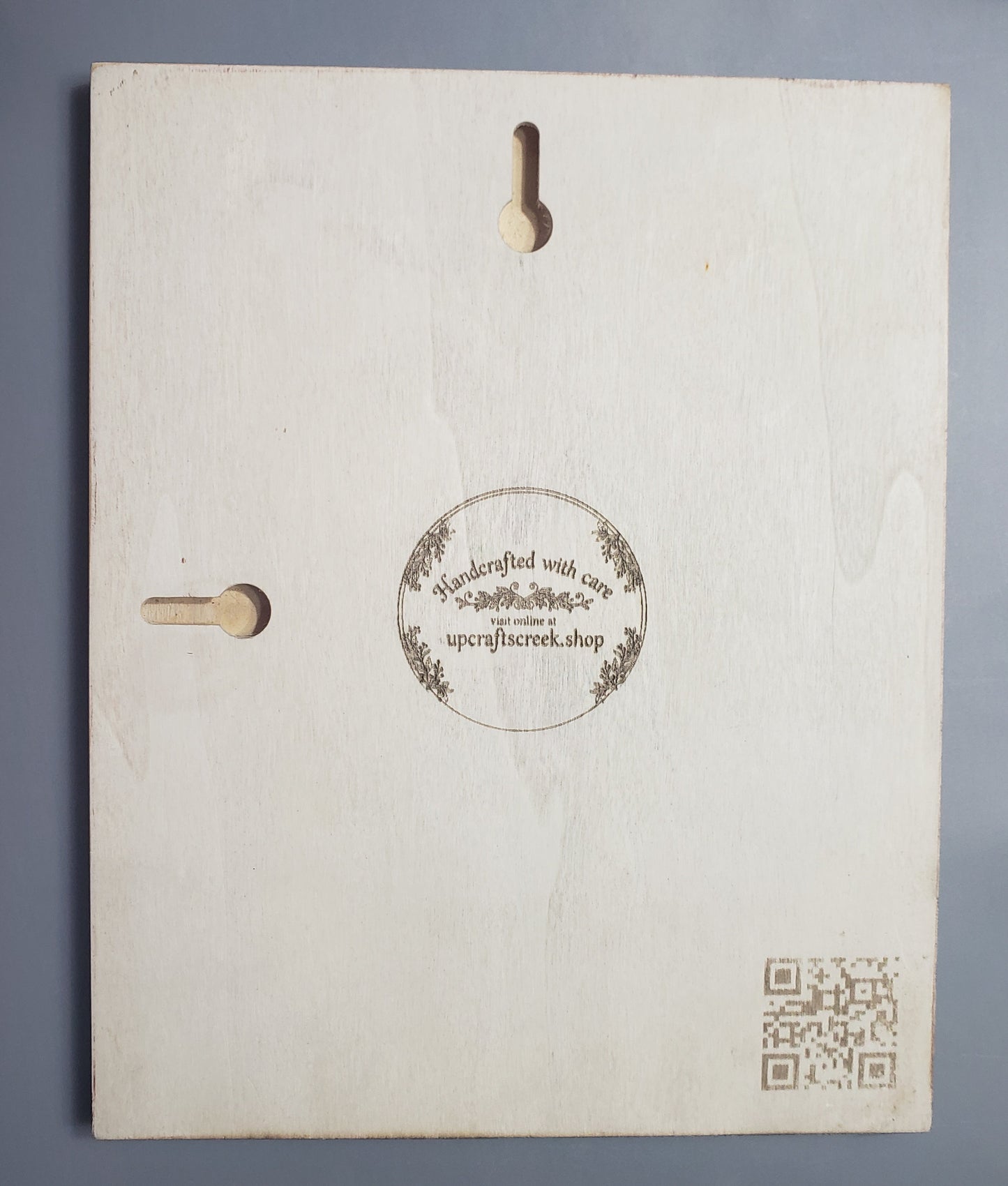 Makers mark with keyhole hangers 