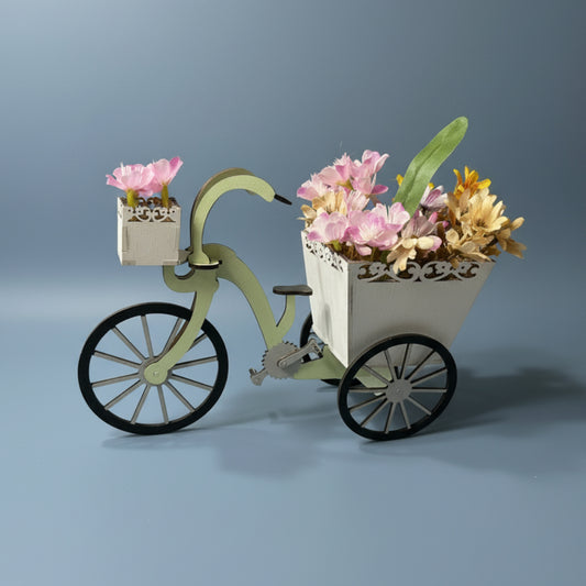 Decorative bicycle planter with flowers.