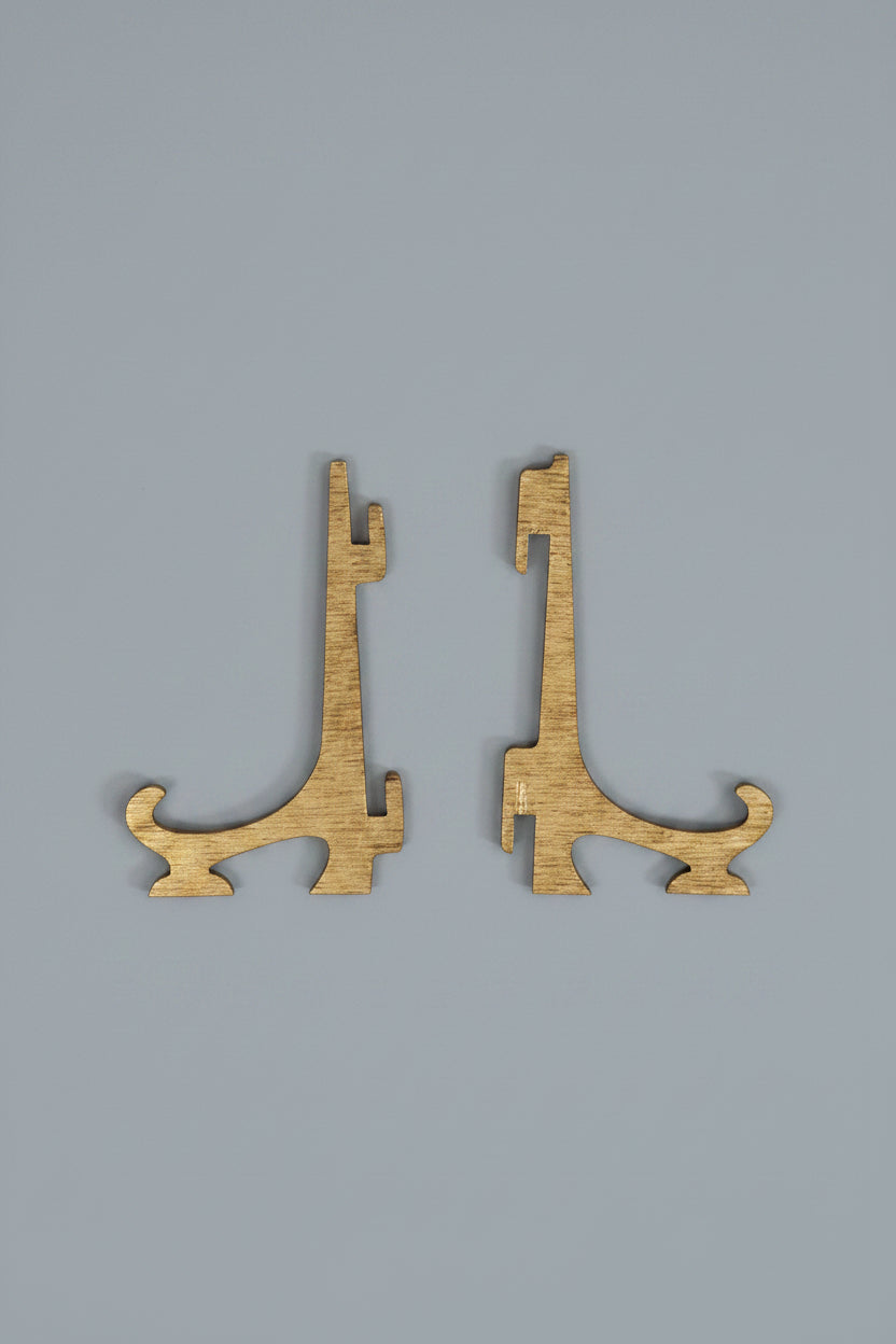 Two small laser-cut wooden pieces with a natural wood grain finish, displayed side-by-side.