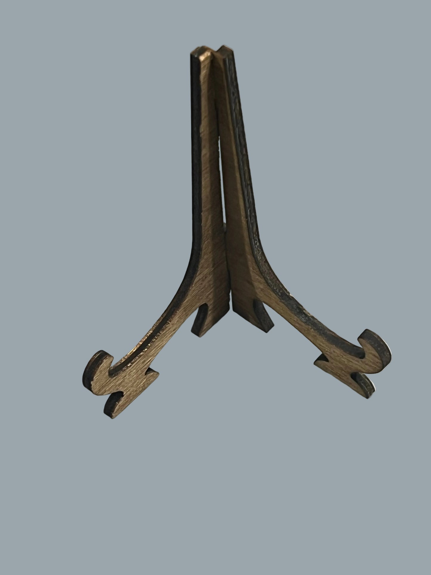 A small wooden easel, shown on a light gray background.