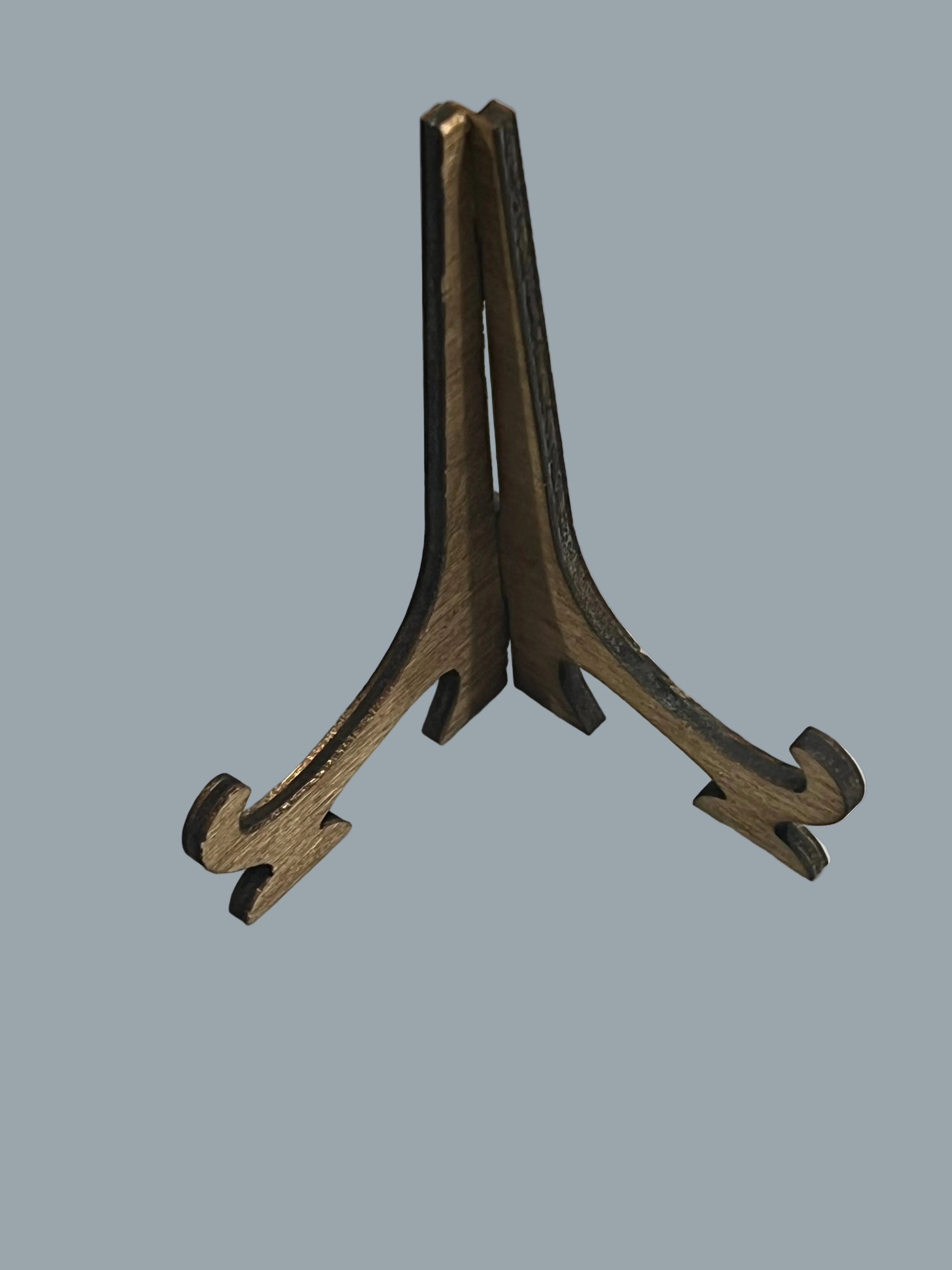 A small wooden easel, shown on a light gray background.