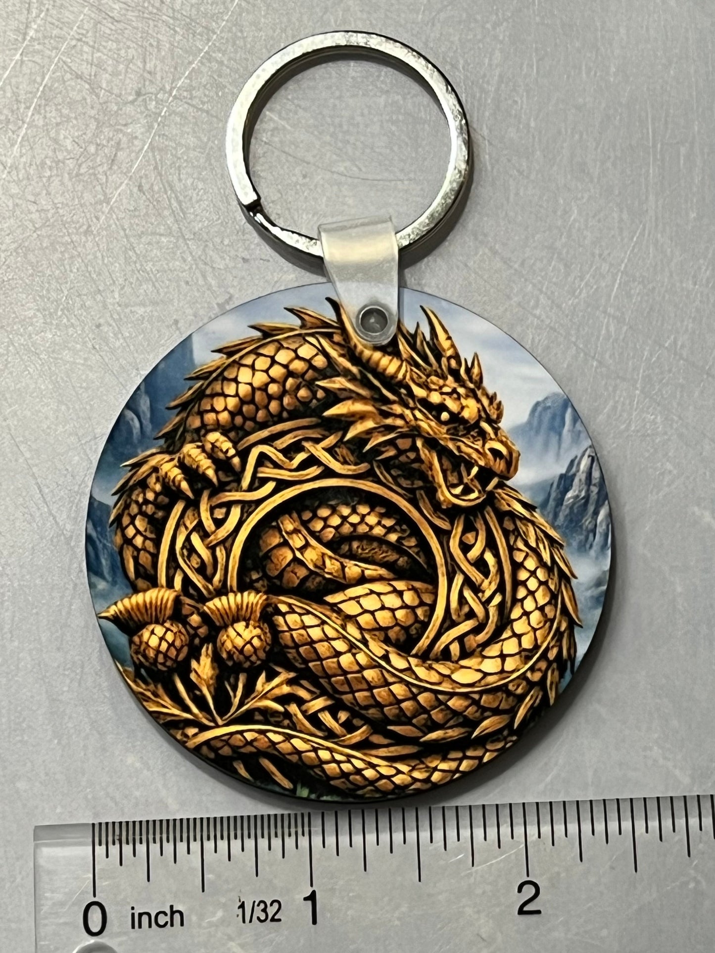 Golden Dragon Keychain shown with a ruler for scale.