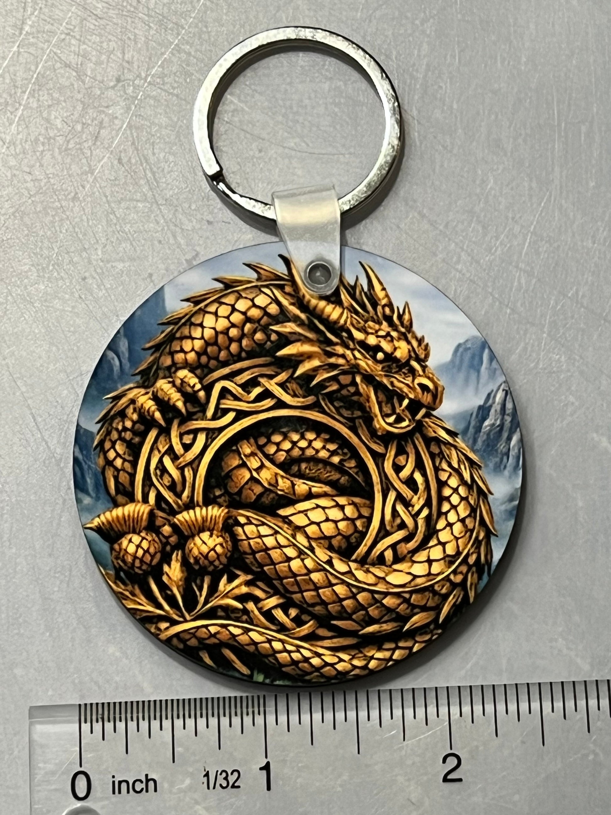 Golden Dragon Keychain shown with a ruler for scale.