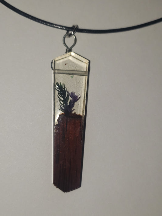 Necklace with a flower and wood pendant on an 18 inch leather cord  