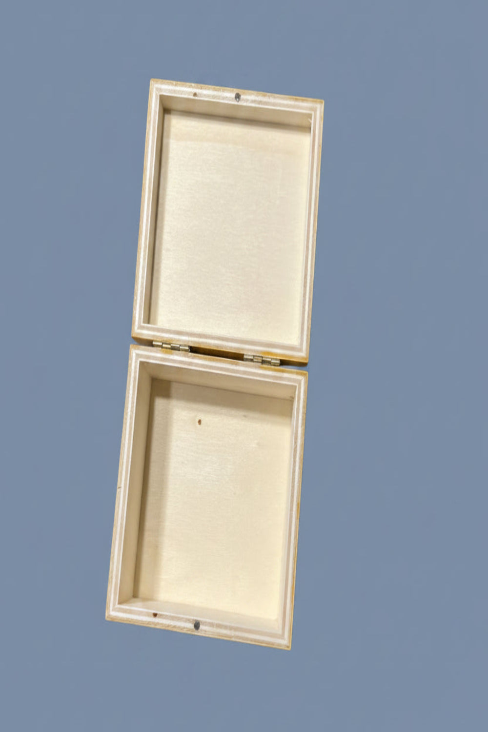 Wooden box with open lid with magnetic closure